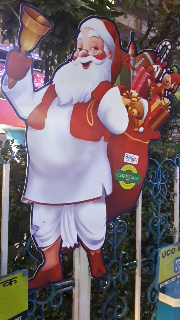 Santa in a traditional dhoti. At the Christmas festival on Park Street in Kolkata. 