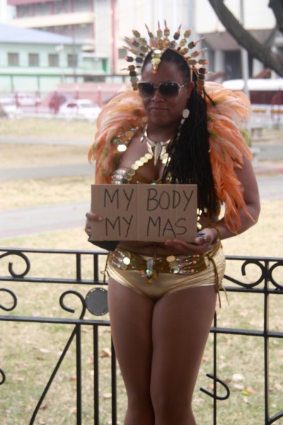 This demonstrator showed up in her Carnival costume to drive home the point that women never "ask for it".