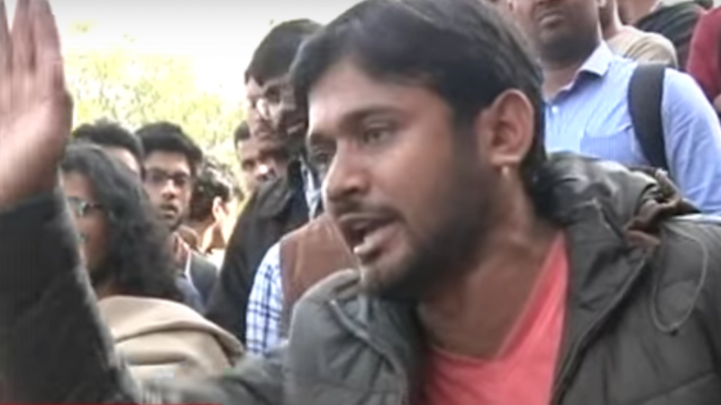 Kanhaiya Kumar, student leader of All India Students Federation (AISF), the student wing of Communist Party of India (CPI) speaking at JNU on 11th of February, 2016. Screenshot from Youtube. Click on the image to listen to his speech (in Hindi)