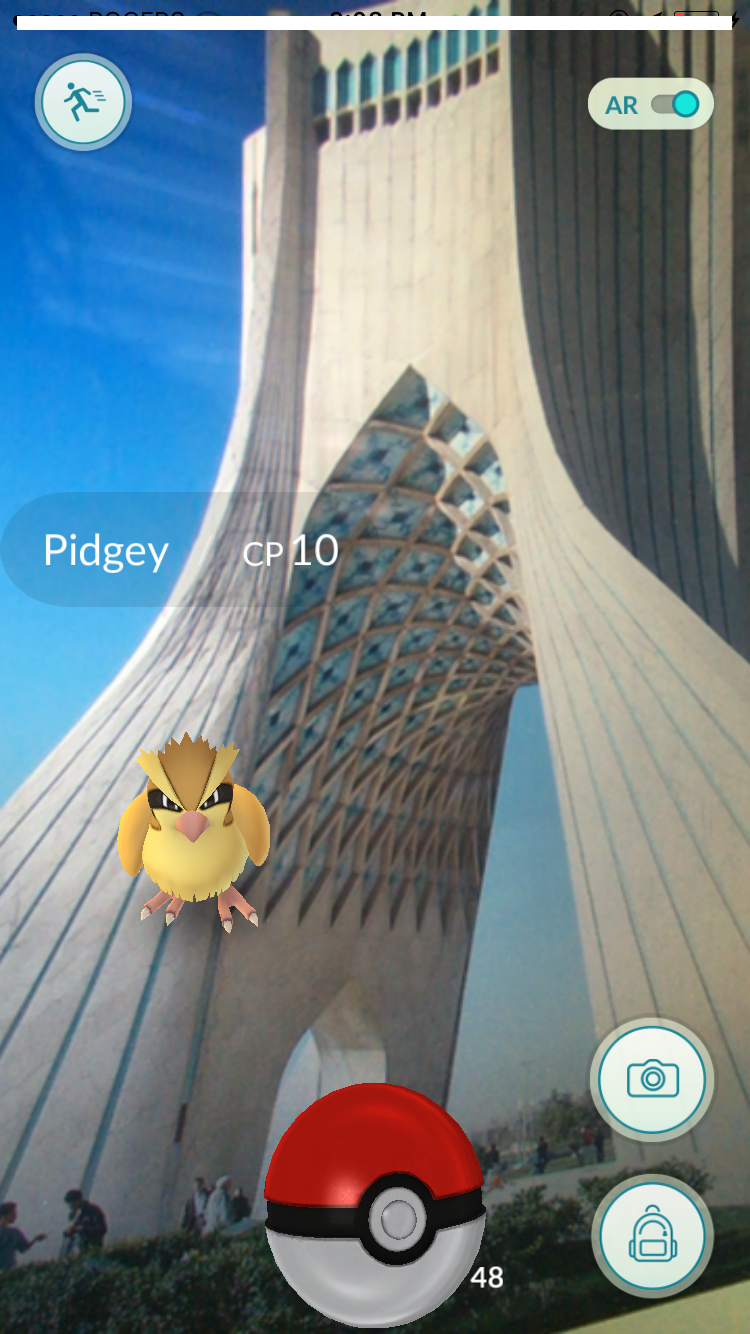 The author of this post imagines playing Pokémon Go in Tehran, holding the game up to a picture of Azadi Tower. 
