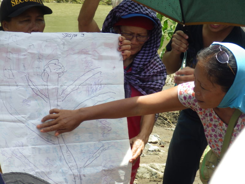 The Tumandok mapping the destruction and displacement to be caused by the construction of the Jalaur Mega Dam. Photo Credits: Jalaur River for the People Movement.