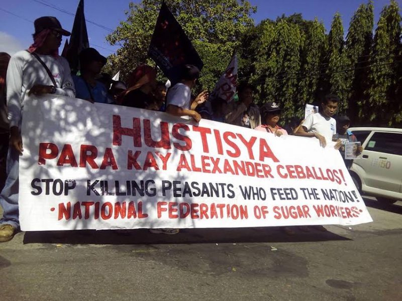'Stop killing peasants who feed the nation.' Farmers decry the killing of an activist leader in Negros Island. Photo emailed by Unyon ng mga Manggagawa sa Agrikultura
