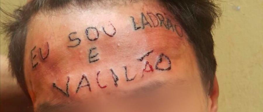 A supporter of President Jair Bolsonaro, donning a tattoo that reads in  Portuguese: 