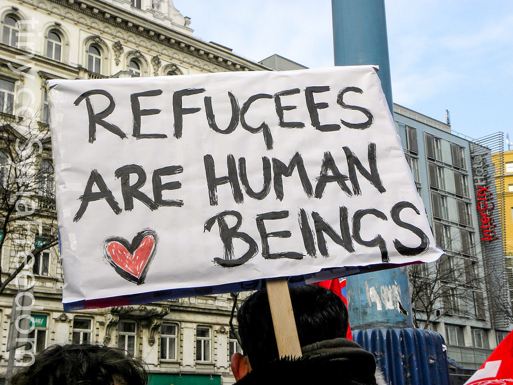 "Refugees Are Human Beings" by FreedomHouse is marked with CC PDM 1.0