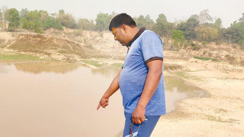 Bachhelal Mahato shows the area where his nephew Anil Mahato drowned