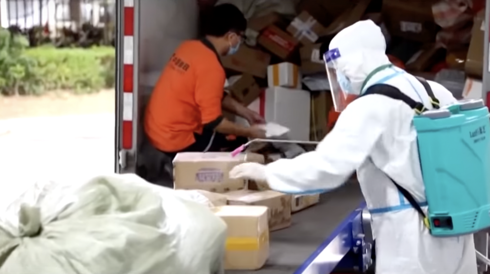 Under China's zero-COVID policy, international mail is disinfected before being distributed in China. Screenshot via <a href="https://www.youtube.com/watch?v=692_DHqblBc&amp;t=42s">YouTube</a>.