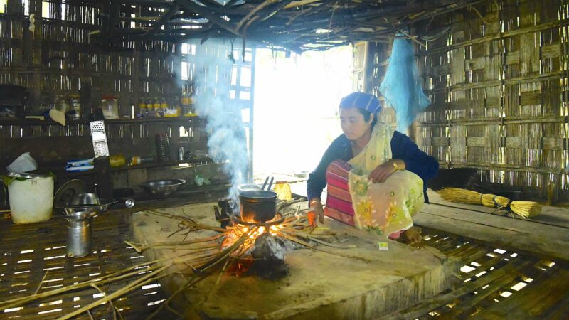 Lotika Mili making tea in her Chang Ghar kitchen. Image by the author.
