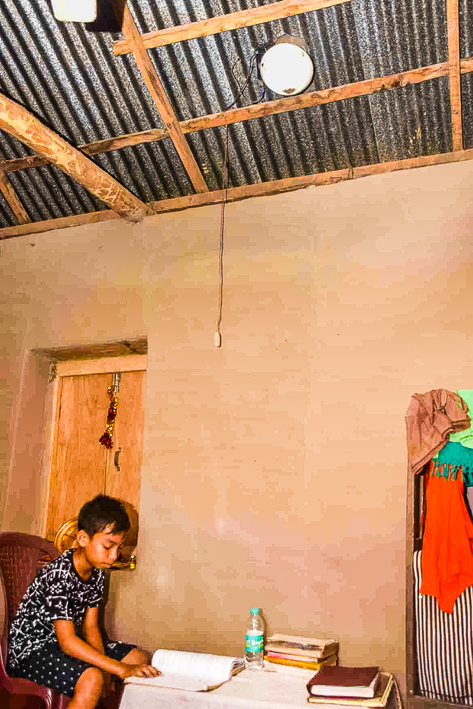 A child from West Bengal’s Kharujhor village pictured studying under MSD light. Image credit: NBIRT. Used with permission.