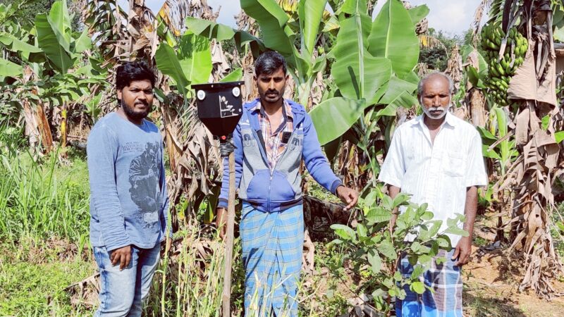 A farmer’s family in V-Kota village of Andhra Pradesh with an installed Parabraksh in their field. 