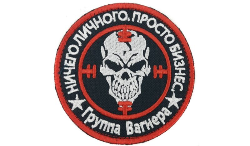 Satirical meme about PMC Wagner Group logo/arm patch, with text in Russian reading "Nothing personal, it's just business. Wagner Group." Author anonymous.