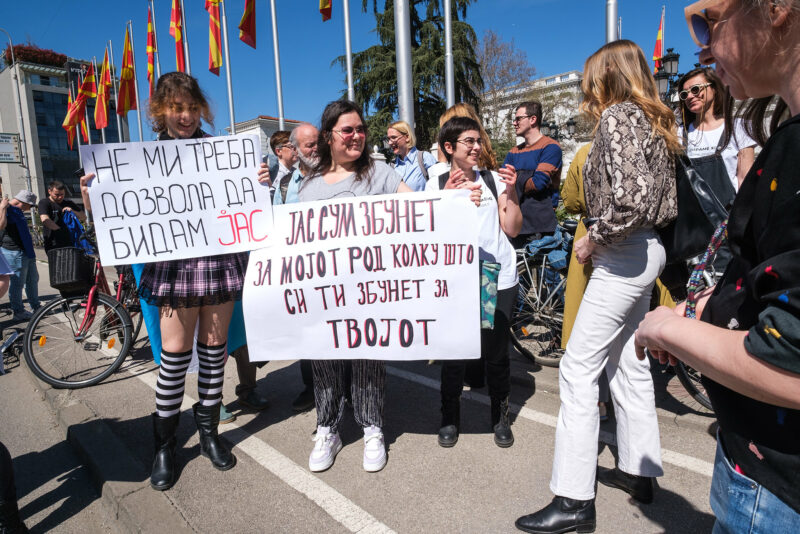 “I don't need permission to be me” and "I'm as confused about my gender identity as you are about yours!" banners at the March for Visibility of Transgender People in Skopje, North Macedonia, March 29, 2024. <a>Photo</a> by Vančo Džambaski, <a>CC-BY-NC-SA</a>, from the photo album <a href="https://www.flickr.com/photos/fosim/albums/72177720315768610/">"Marching Boldly."</a>